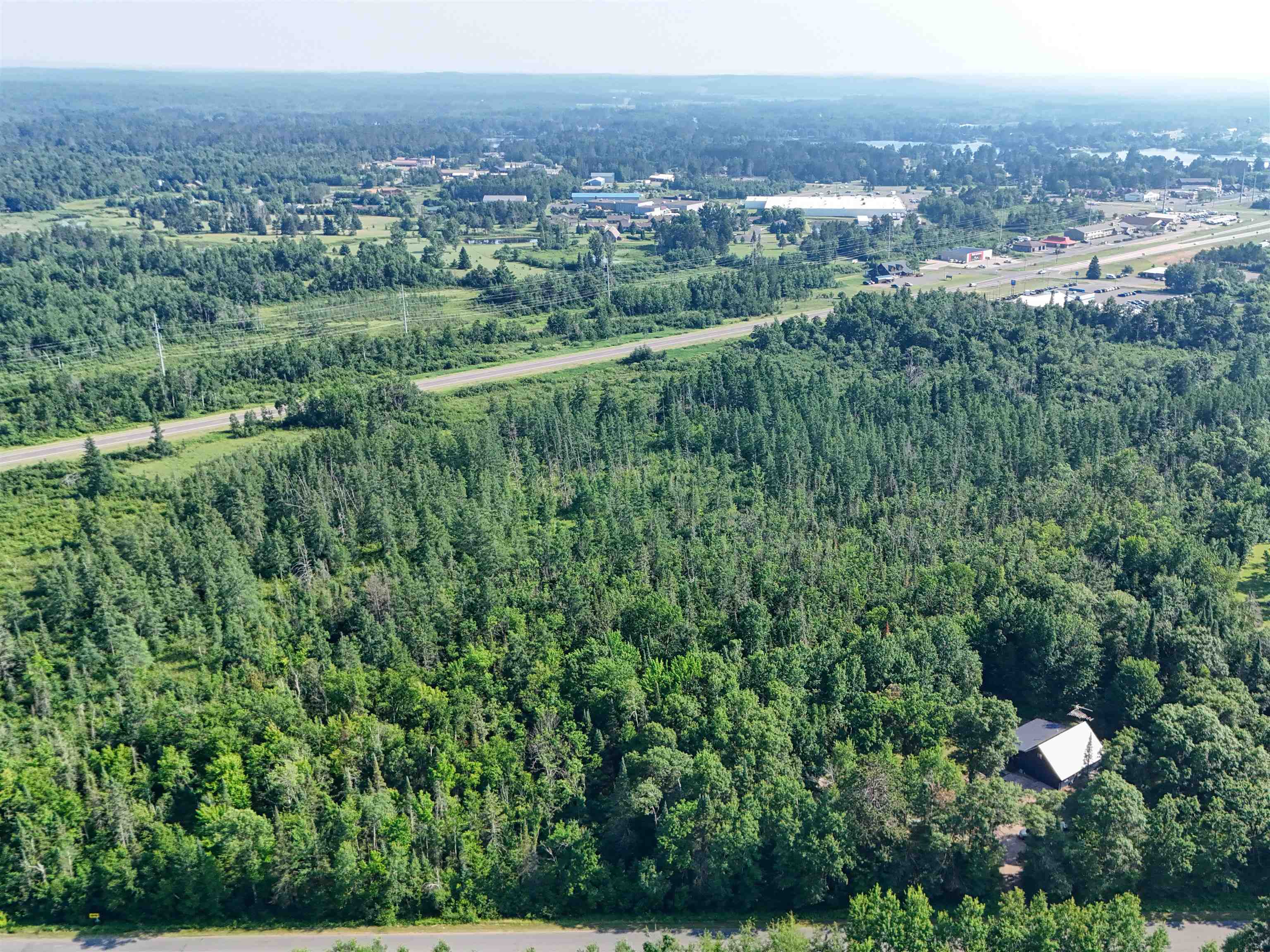 15531 West Hospital Road Hayward, WI 54843 - Photo 15 of 71 Aerial overview of property's location featuring a heavily wooded area