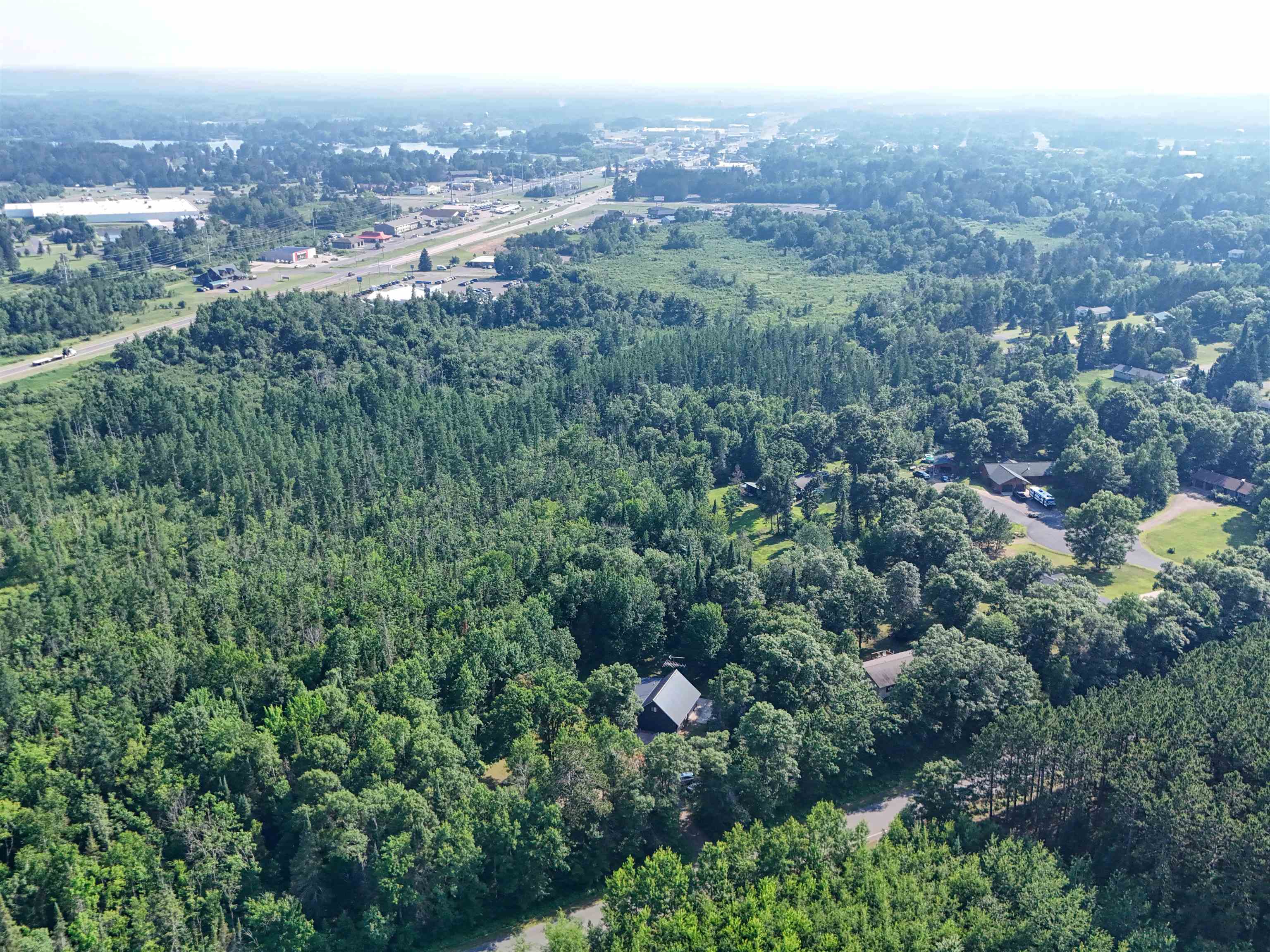 15531 West Hospital Road Hayward, WI 54843 - Photo 17 of 71 Aerial overview of property's location with a forest