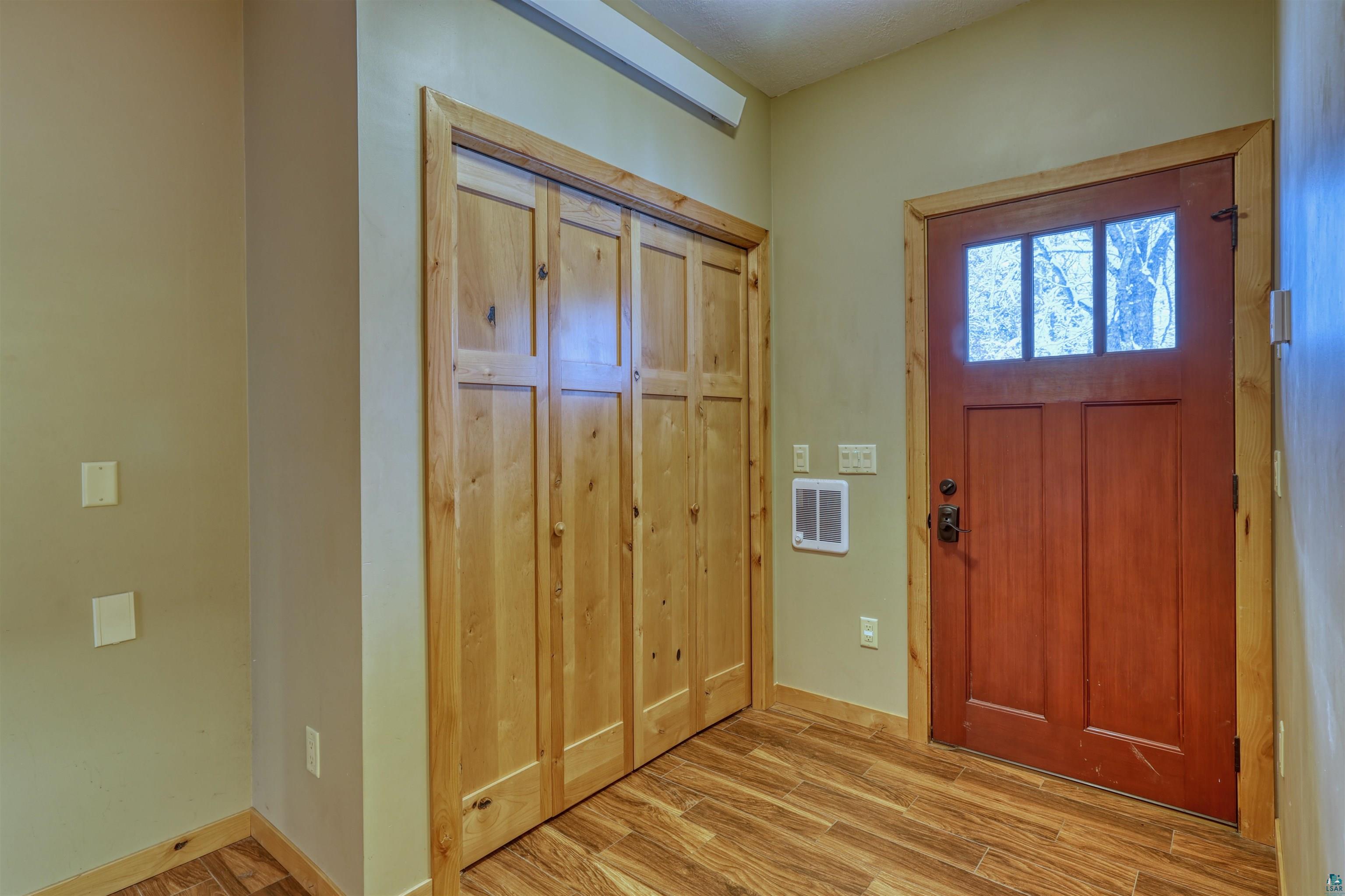 15531 West Hospital Road Hayward, WI 54843 - Photo 21 of 71 Foyer entrance featuring light wood-style flooring and baseboards