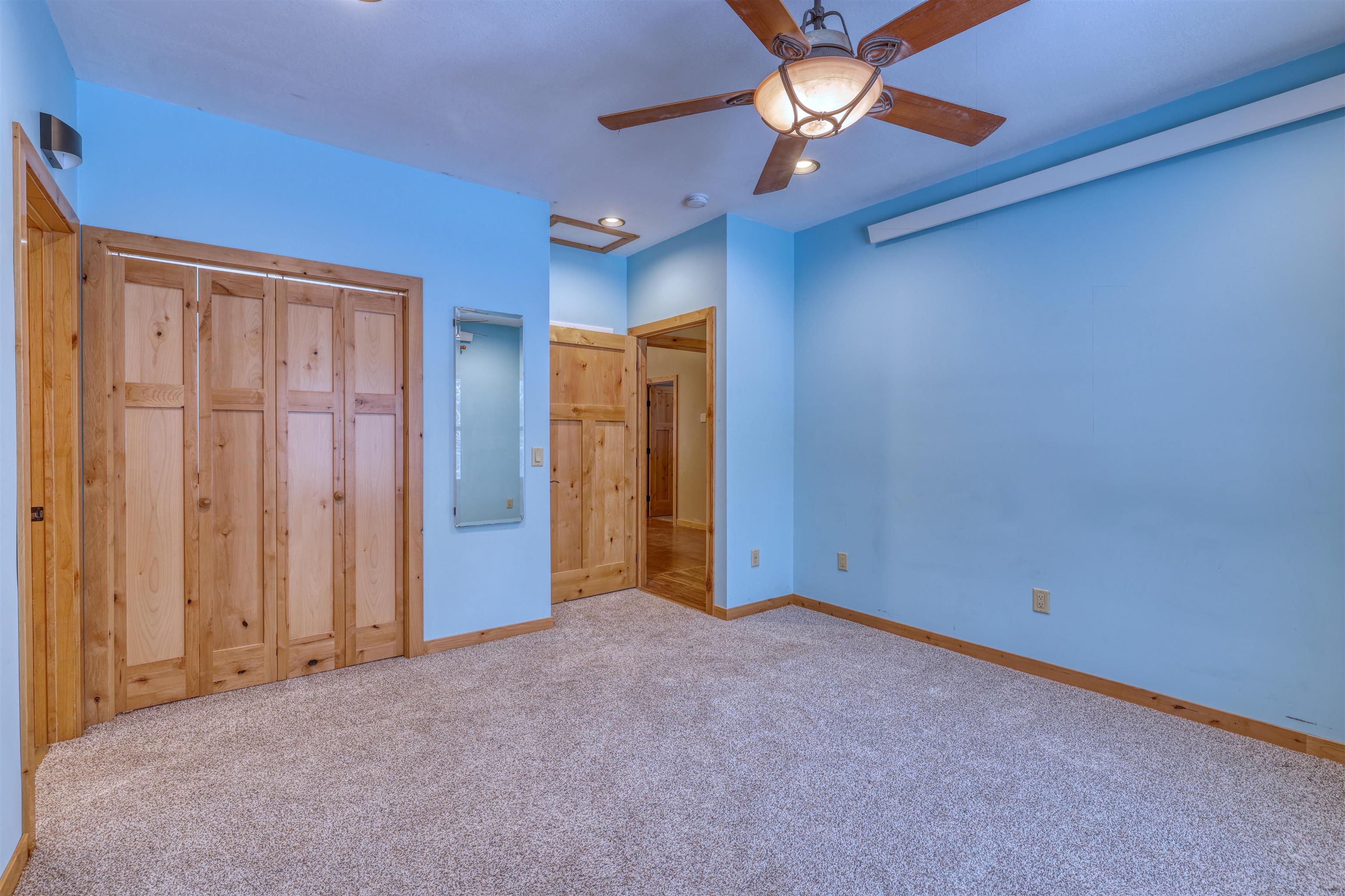 15531 West Hospital Road Hayward, WI 54843 - Photo 35 of 71 Unfurnished bedroom featuring a closet, attic access, carpet flooring, ceiling fan, and recessed lighting