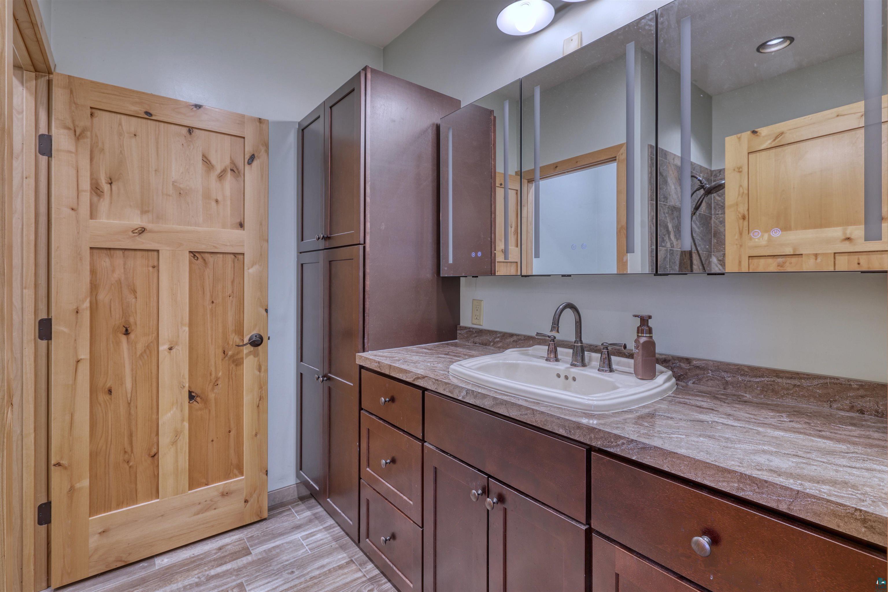15531 West Hospital Road Hayward, WI 54843 - Photo 37 of 71 Bathroom with vanity and wood tiled floors
