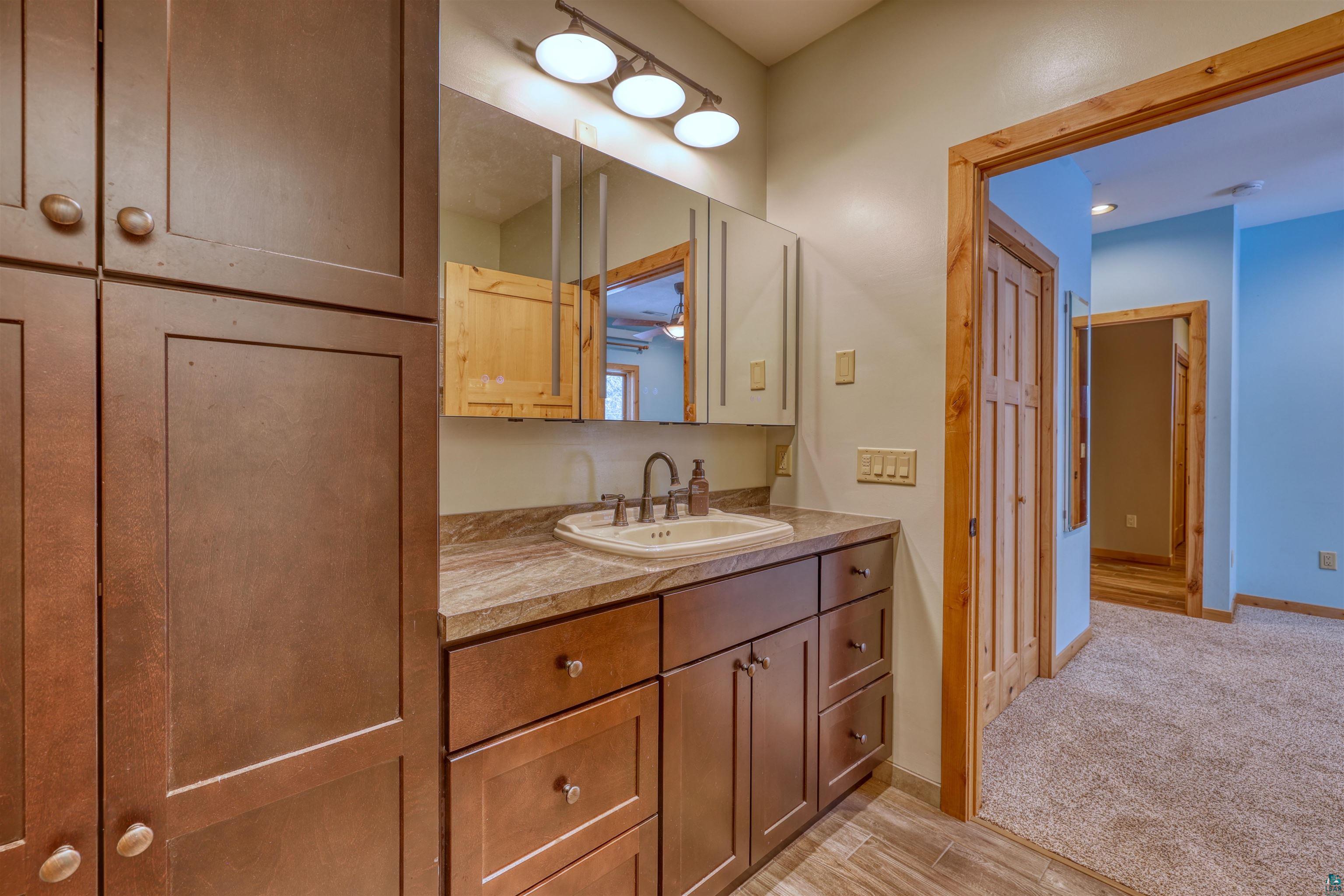 15531 West Hospital Road Hayward, WI 54843 - Photo 39 of 71 Bathroom featuring vanity and light wood-style flooring