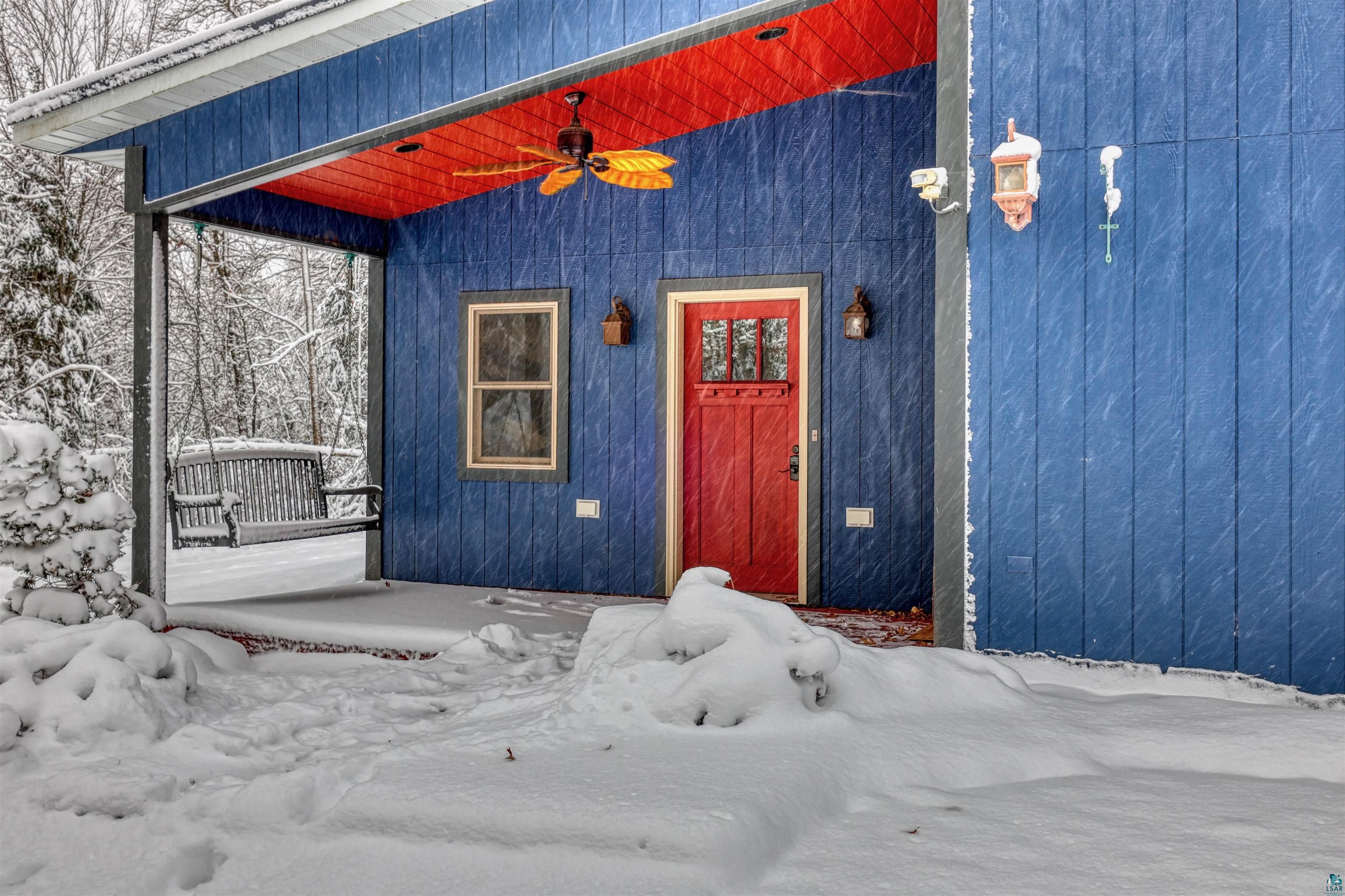 15531 West Hospital Road Hayward, WI 54843 - Photo 4 of 71 Snow covered property entrance with a ceiling fan