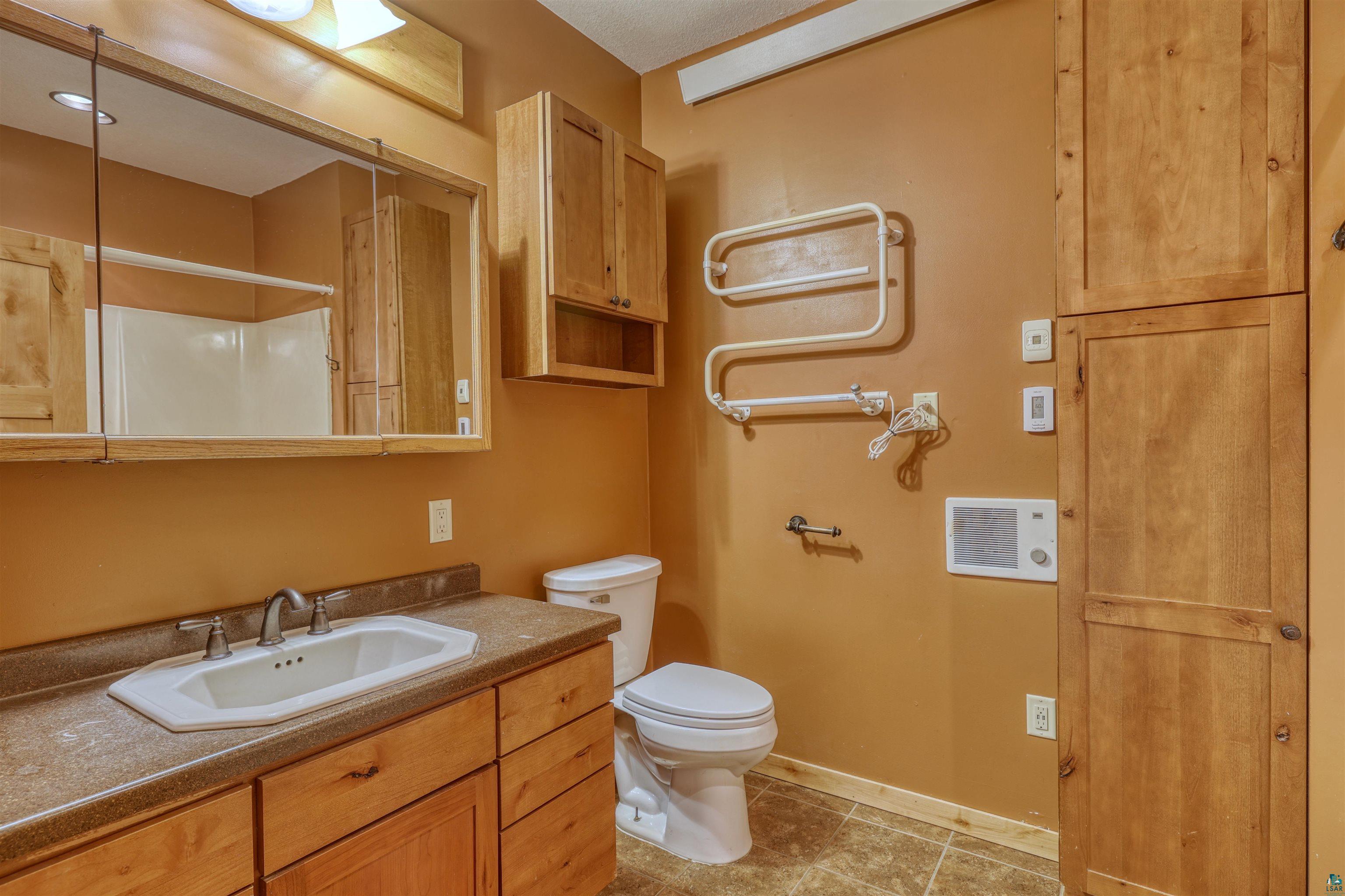 15531 West Hospital Road Hayward, WI 54843 - Photo 44 of 71 Bathroom with a shower, vanity, and light tile patterned floors