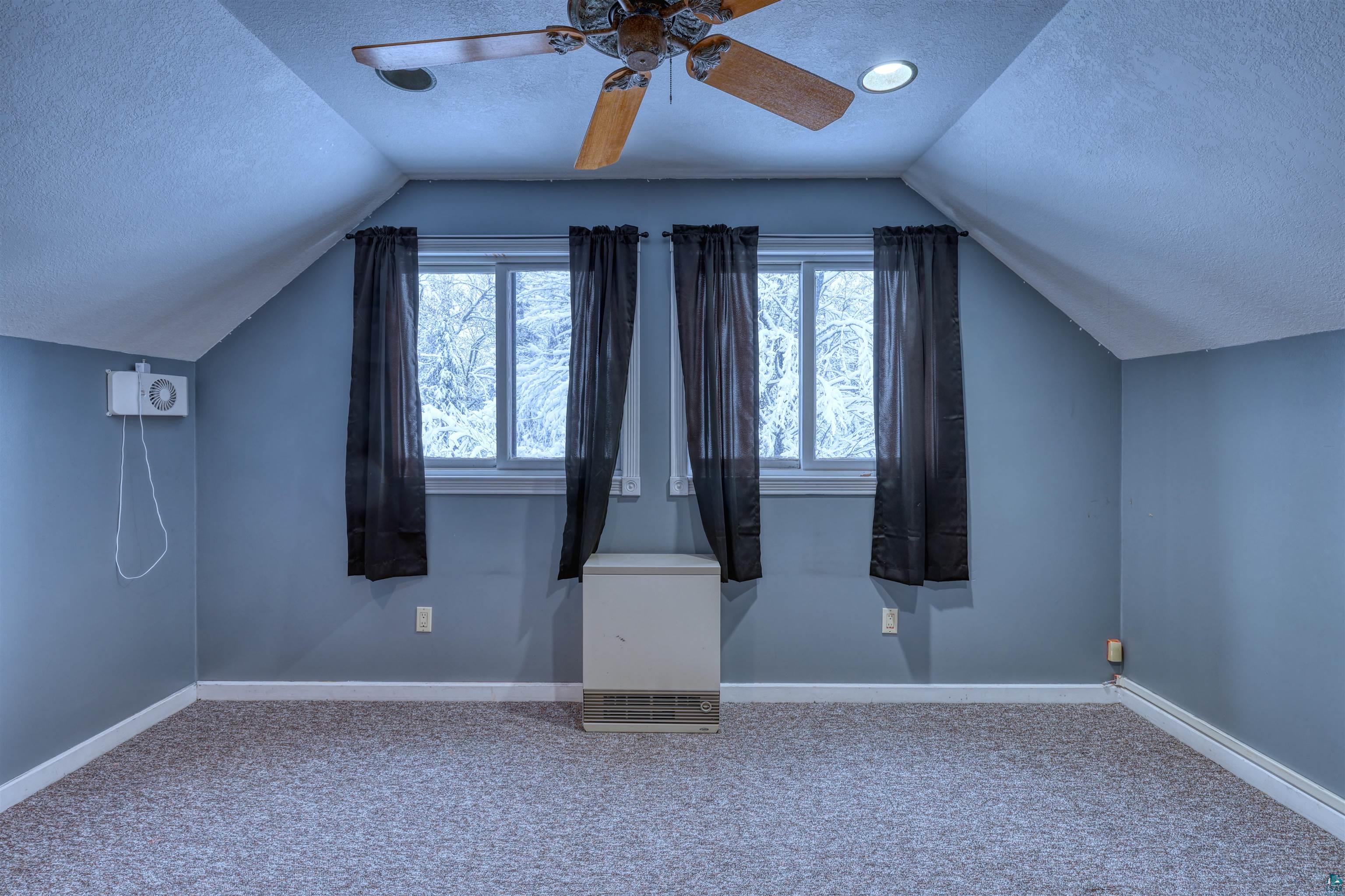 15531 West Hospital Road Hayward, WI 54843 - Photo 46 of 71 Additional living space featuring a textured ceiling, carpet floors, ceiling fan, and lofted ceiling