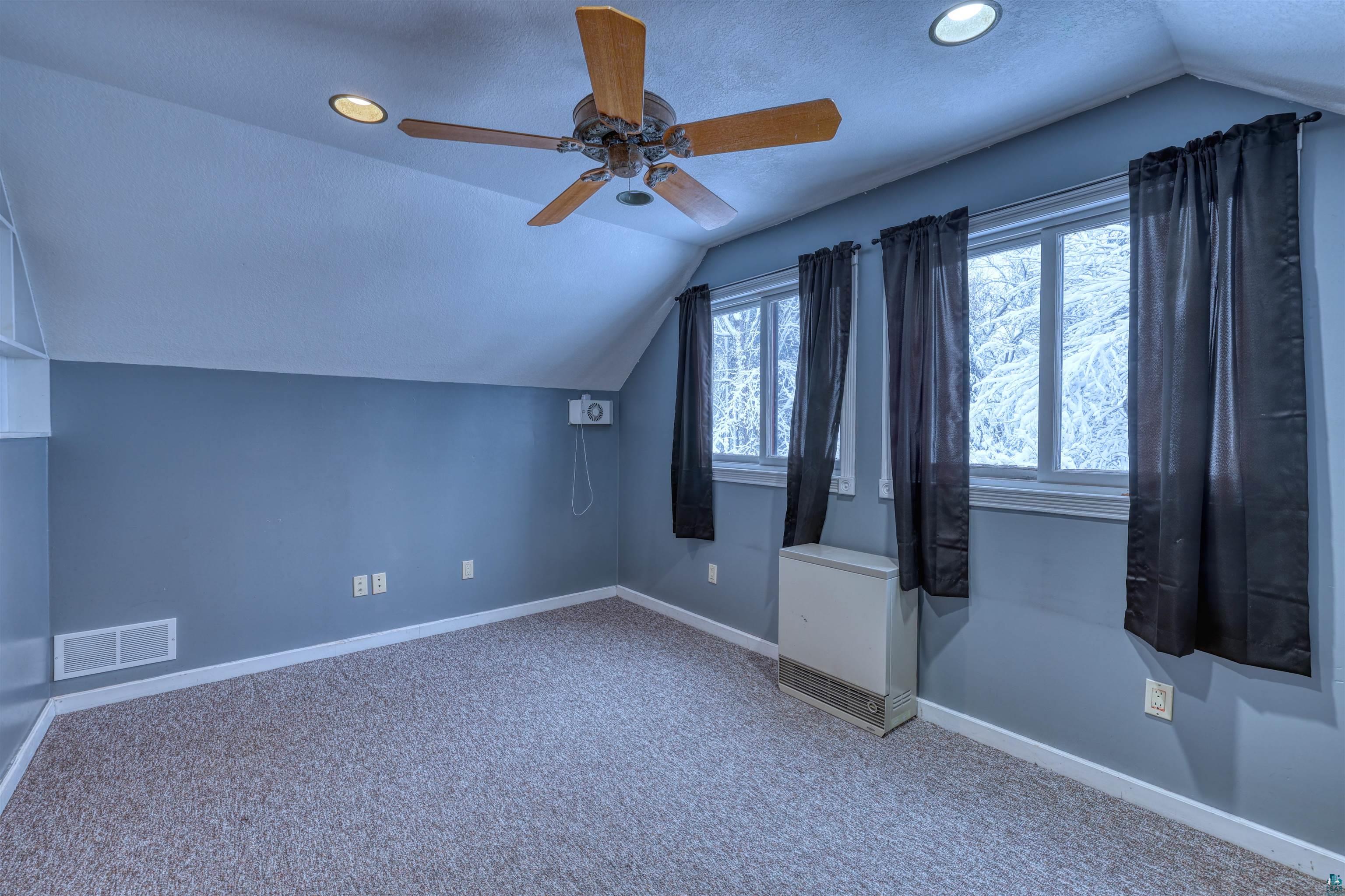 15531 West Hospital Road Hayward, WI 54843 - Photo 47 of 71 Additional living space with lofted ceiling, a textured ceiling, carpet, a ceiling fan, and recessed lighting