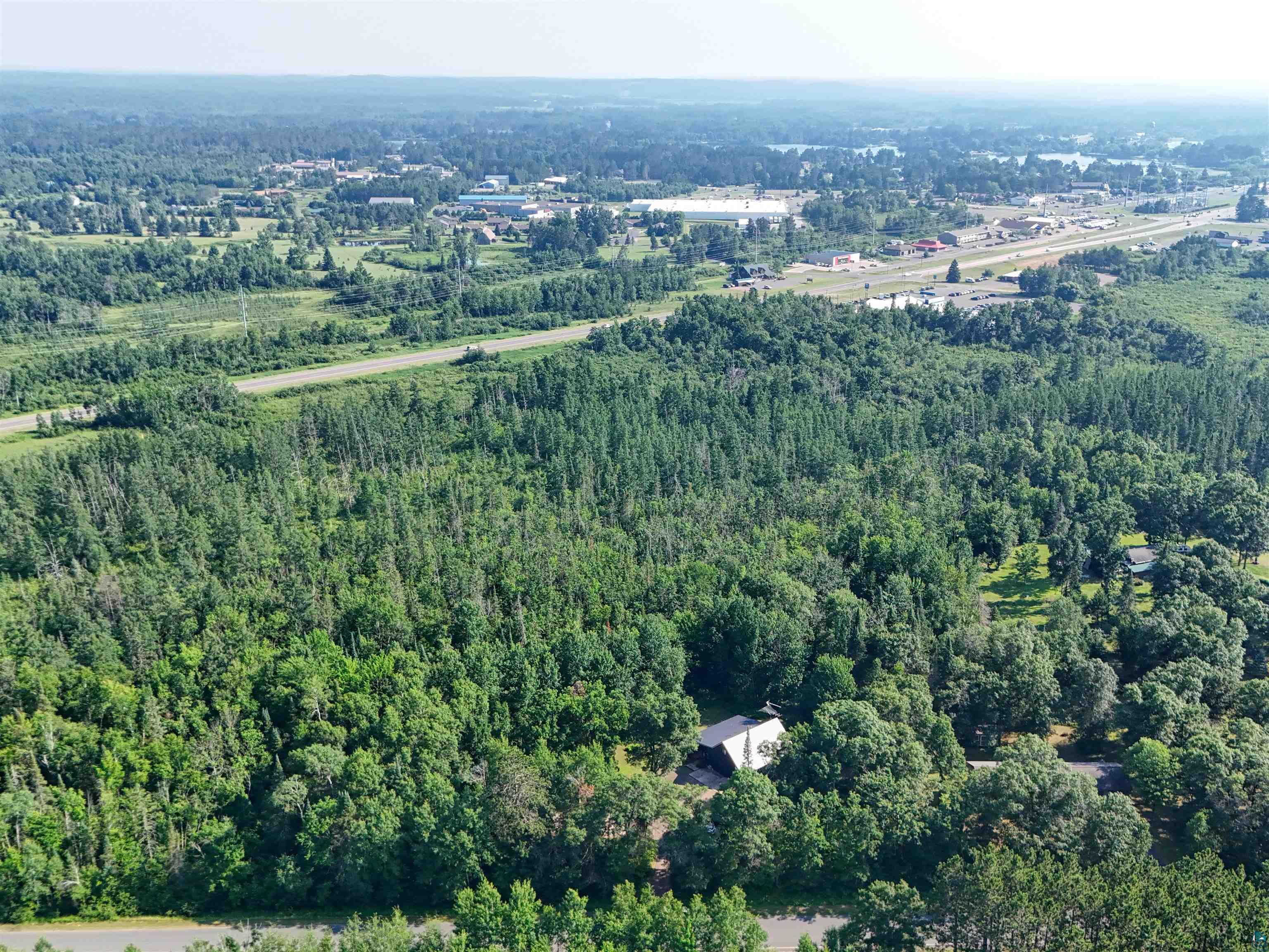 15531 West Hospital Road Hayward, WI 54843 - Photo 67 of 71 Aerial overview of property's location with a heavily wooded area