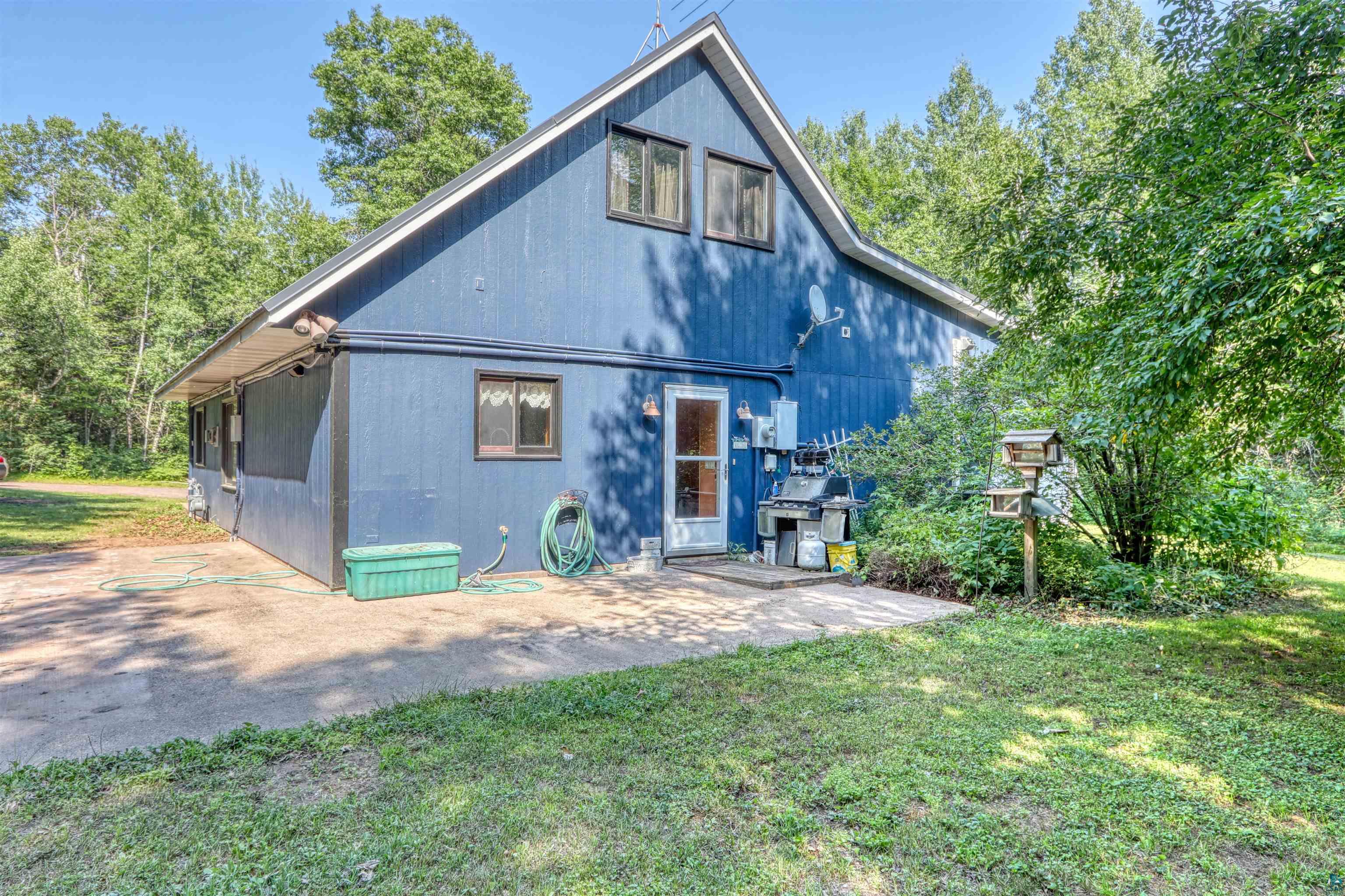 15531 West Hospital Road Hayward, WI 54843 - Photo 68 of 71 Rear view of house featuring a lawn and a patio
