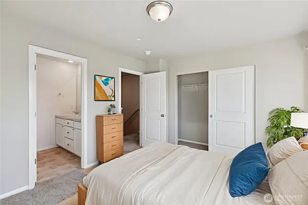 a bathroom with a sink double vanity granite tub shower and a mirror