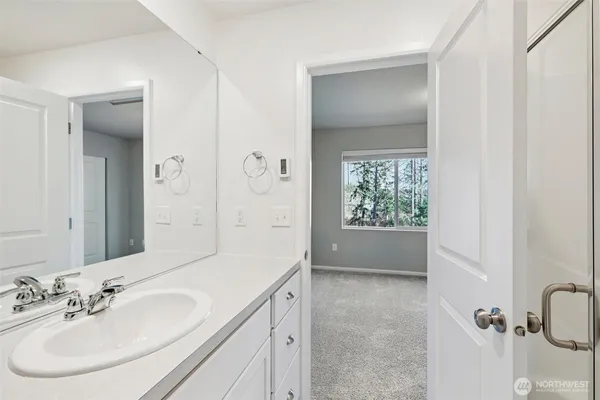 a bathroom with a sink toilet and vanity