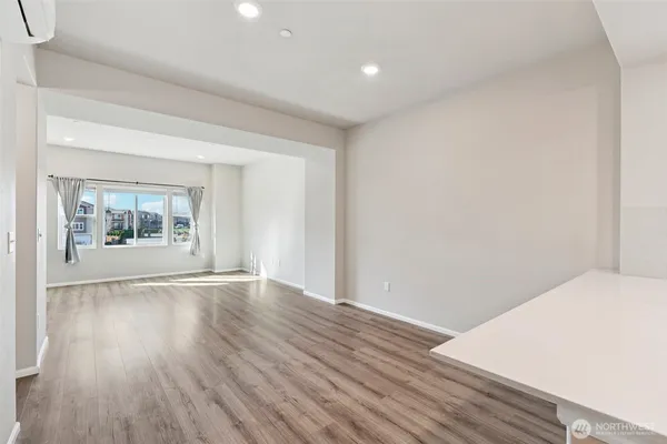 a kitchen with stainless steel appliances a stove a sink and a refrigerator
