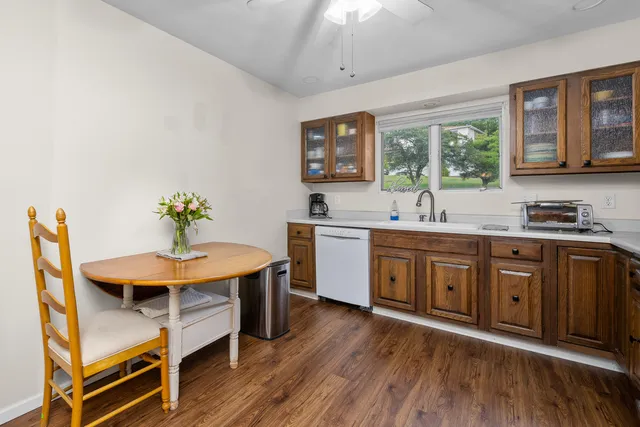 a kitchen with a sink cabinets and window