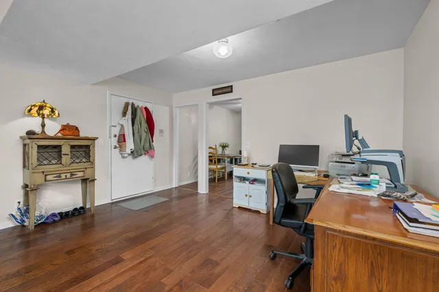 a workspace with furniture and wooden floor
