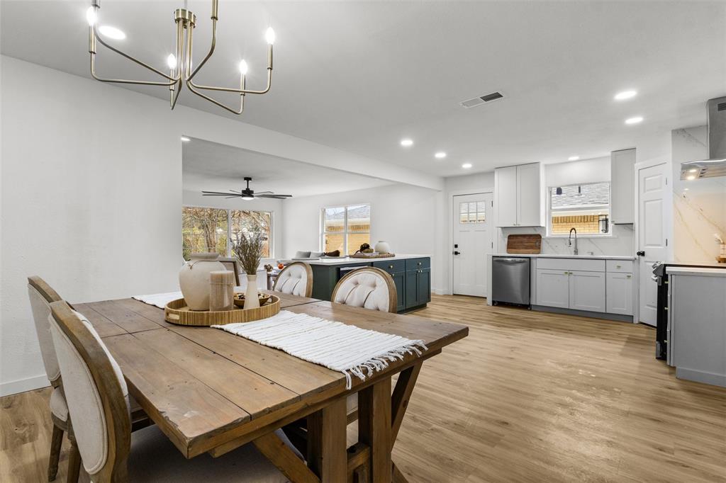 1917 South Vernon Avenue Dallas, TX 75224 - Photo 15 of 28 Open-concept living space featuring wood-finish flooring, recessed lighting, and a modern chandelier