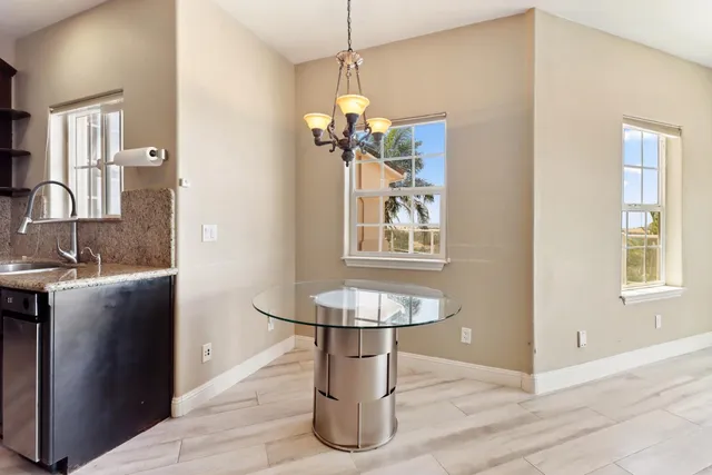 a view of an empty room with a flat screen tv and a window