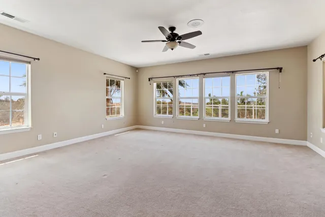 a bath tub sitting next to a bathroom sink