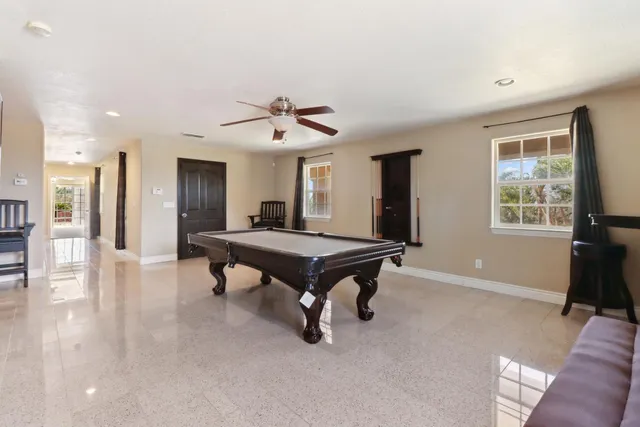 a kitchen with stainless steel appliances granite countertop a stove microwave and sink