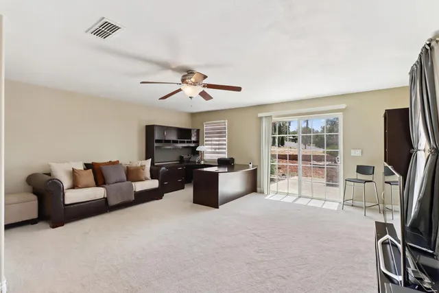 a bathroom with a granite countertop sink toilet a shower and mirror