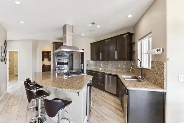 a spacious bathroom with a tub sink shower and mirror