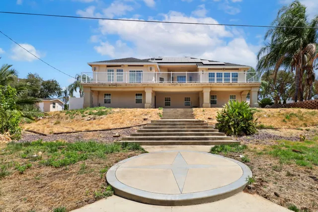an aerial view of residential building and ocean view