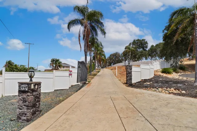 an aerial view of residential houses with city view
