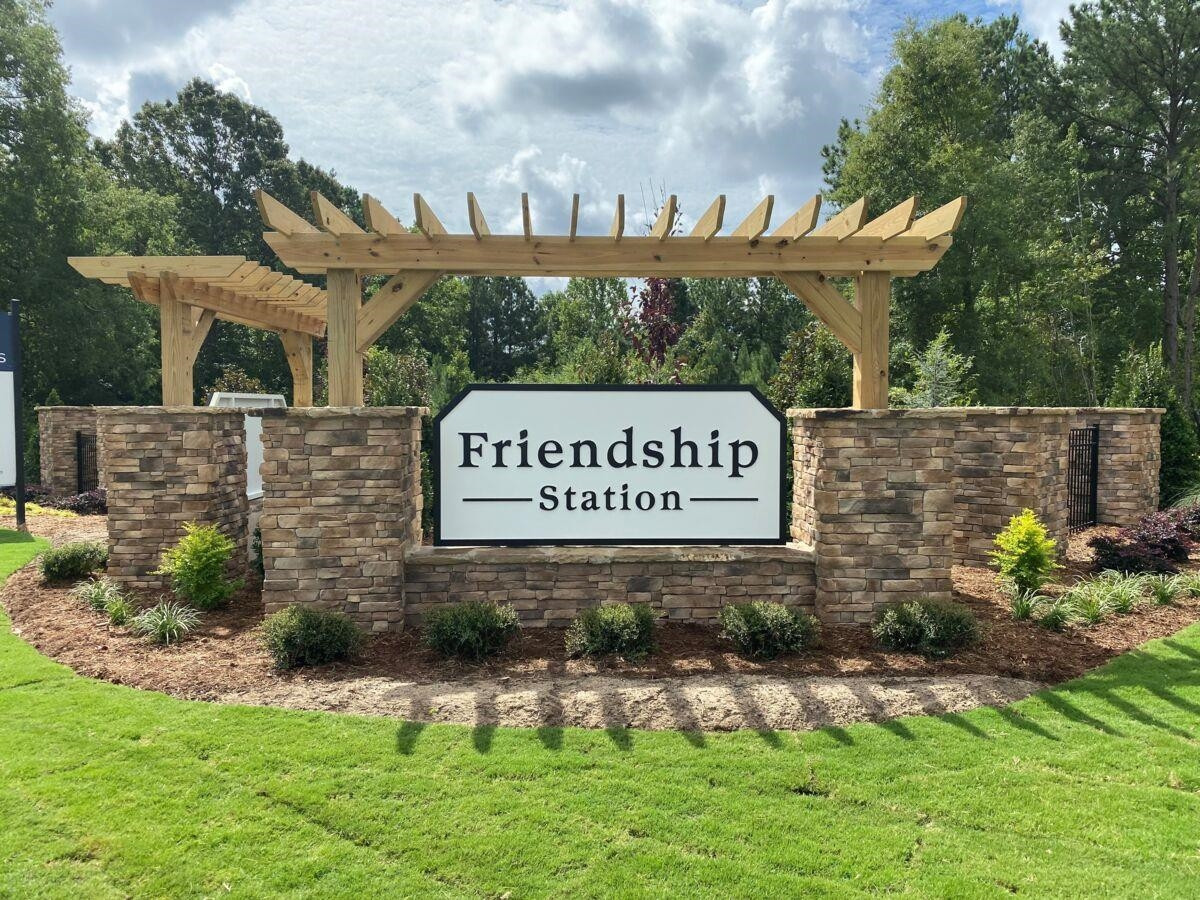 2443 McKenzie Ridge Lane, Unit 160 Apex, NC 27502 - Photo 2 of 3 a sign that is on a brick wall