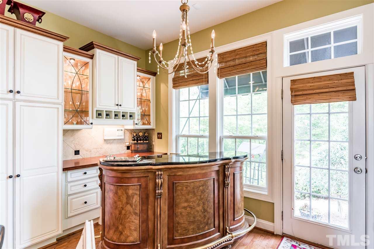2247 Clayette Court Raleigh, NC 27612 - Photo 15 of 25 a kitchen with stainless steel appliances a window and cabinets