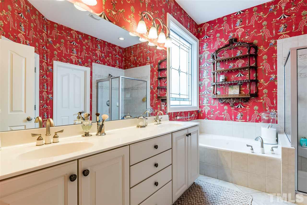 2247 Clayette Court Raleigh, NC 27612 - Photo 18 of 25 a bathroom with a double vanity sink mirror and bathtub