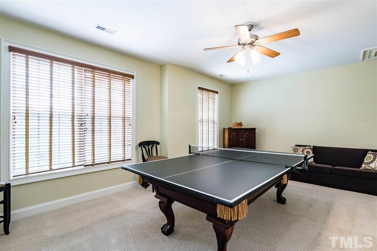 2247 Clayette Court Raleigh, NC 27612 - Photo 22 of 25 a living room with furniture and a window