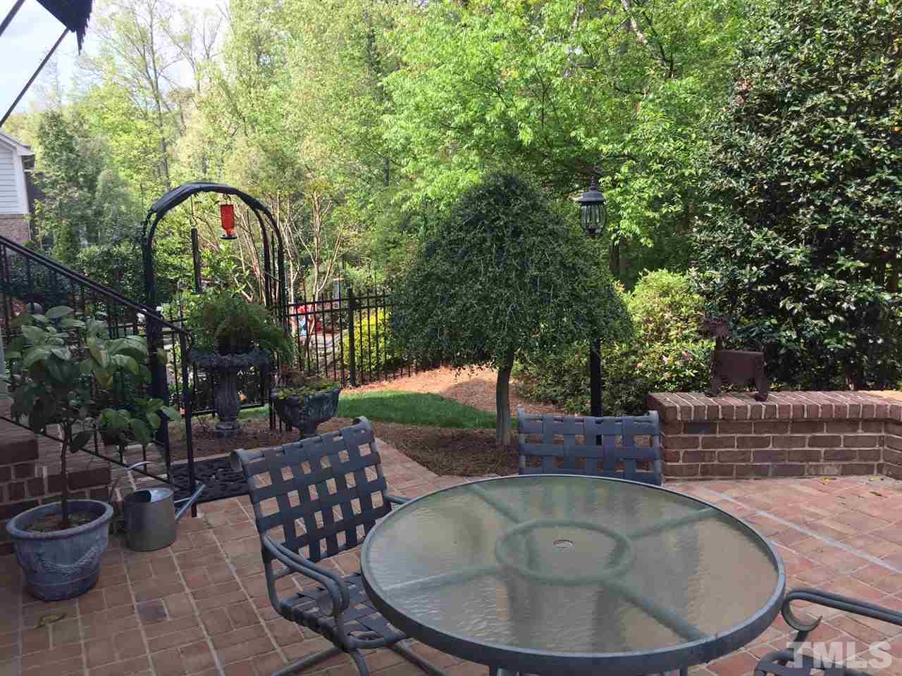 2247 Clayette Court Raleigh, NC 27612 - Photo 25 of 25 a backyard of a house with fountain table and chairs