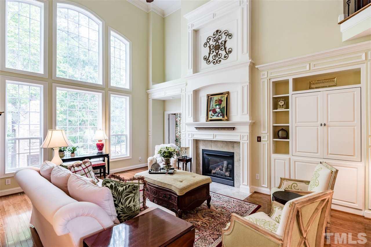 2247 Clayette Court Raleigh, NC 27612 - Photo 7 of 25 a living room with furniture large window and a fireplace