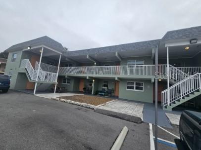2035 Alpine Road, Unit 6 Clearwater, FL 33755 - Photo 1 of 17 a view of a house with a wooden deck