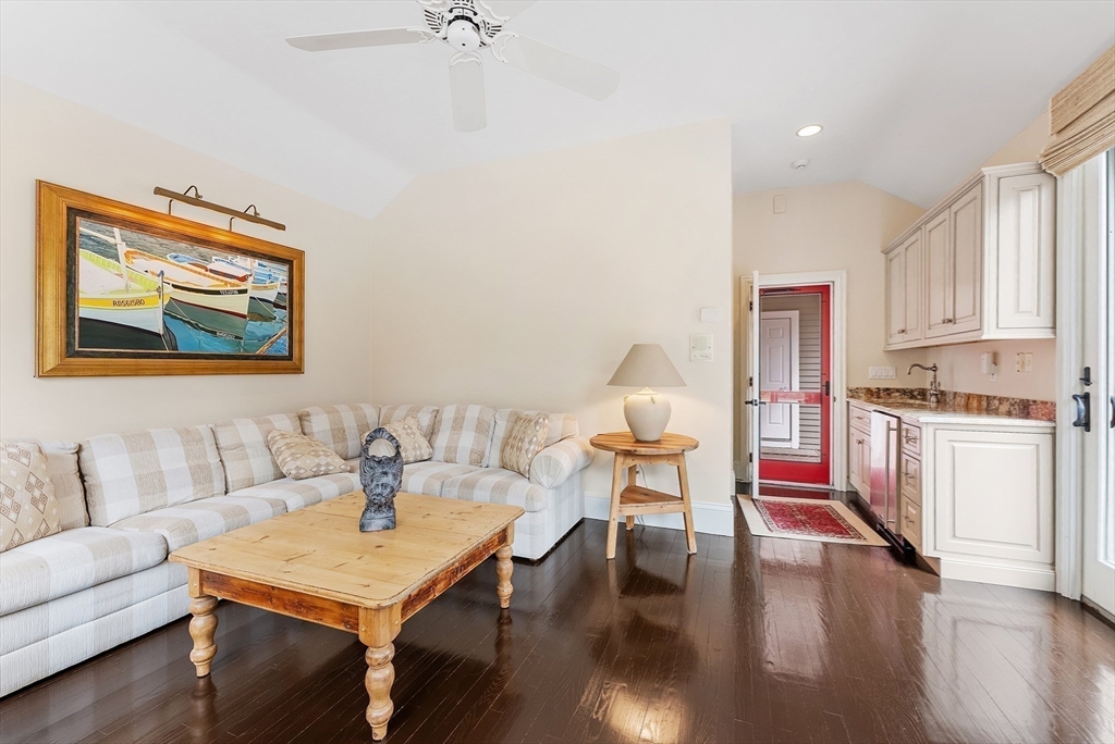 203 Willowbend Drive Mashpee, MA 02649 - Photo 30 of 41 a living room with furniture and kitchen view