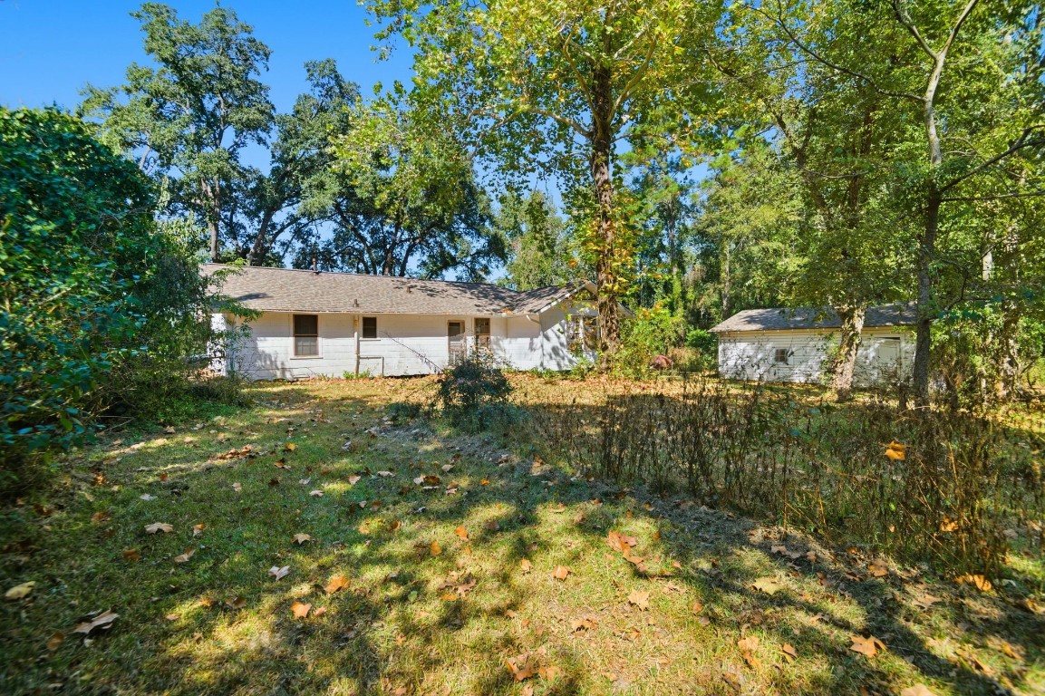 1200 Foster Drive Conroe, TX 77301 - Photo 11 of 18 a view of a house with a yard