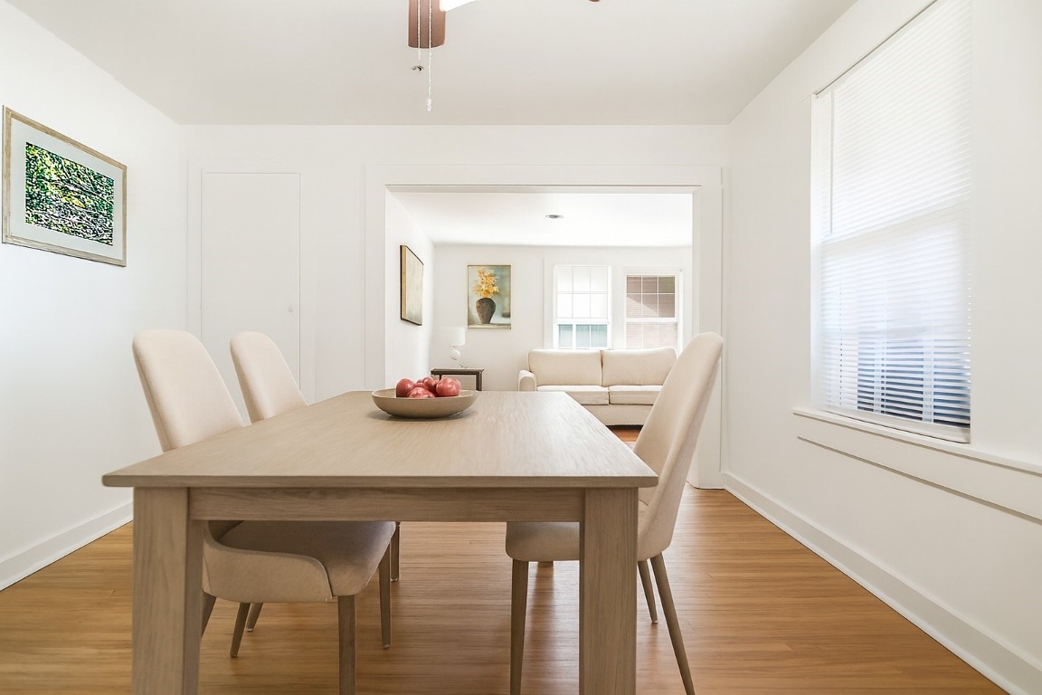 1200 Foster Drive Conroe, TX 77301 - Photo 6 of 18 a view of a dining room with furniture and wooden floor