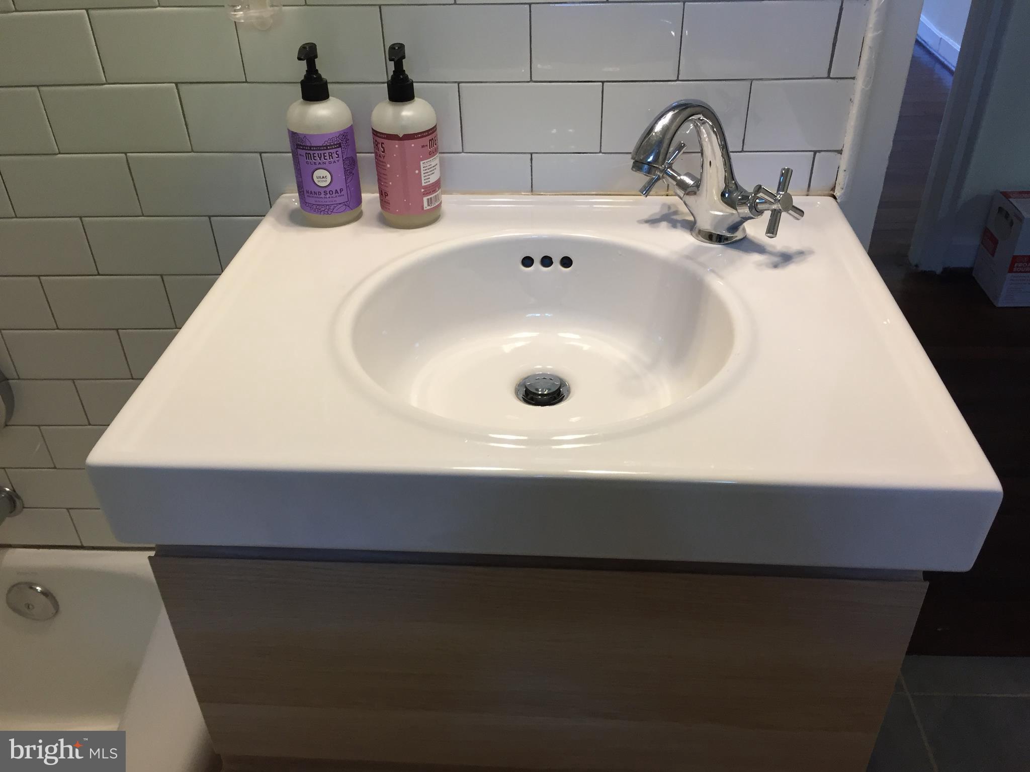 111 East Glebe Road, Unit D Alexandria, VA 22305 - Photo 11 of 14 a bathroom with a sink and mirror