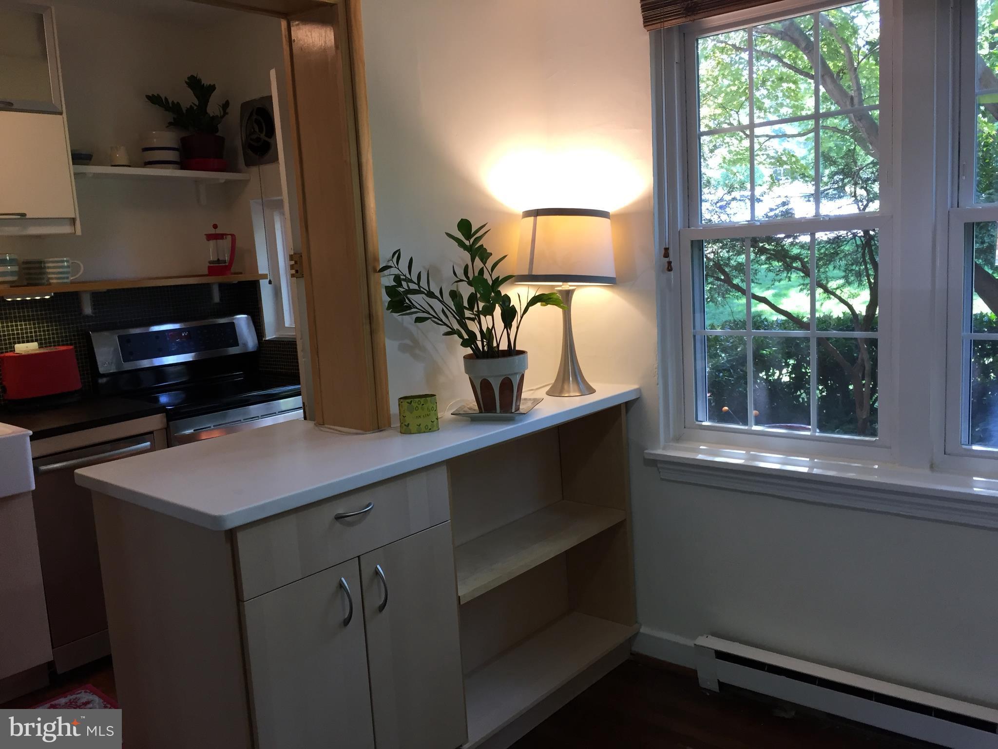 111 East Glebe Road, Unit D Alexandria, VA 22305 - Photo 6 of 14 a kitchen with a sink and a window