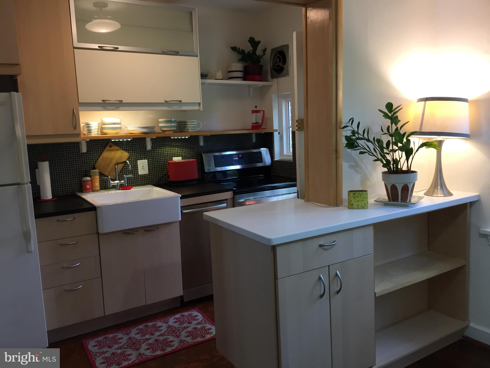 111 East Glebe Road, Unit D Alexandria, VA 22305 - Photo 7 of 14 a kitchen with a sink and cabinets
