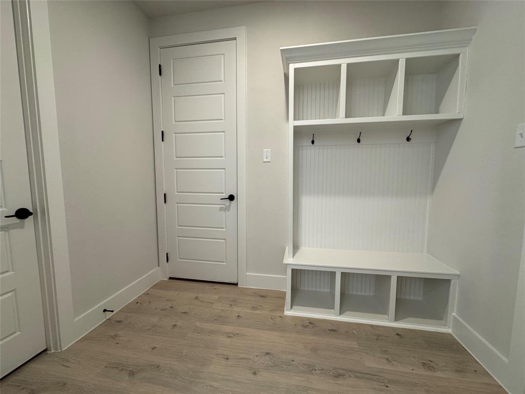 137 Red Fox Trail Godley, TX 76044 - Photo 17 of 18 a view of an empty room with wooden floor and closet