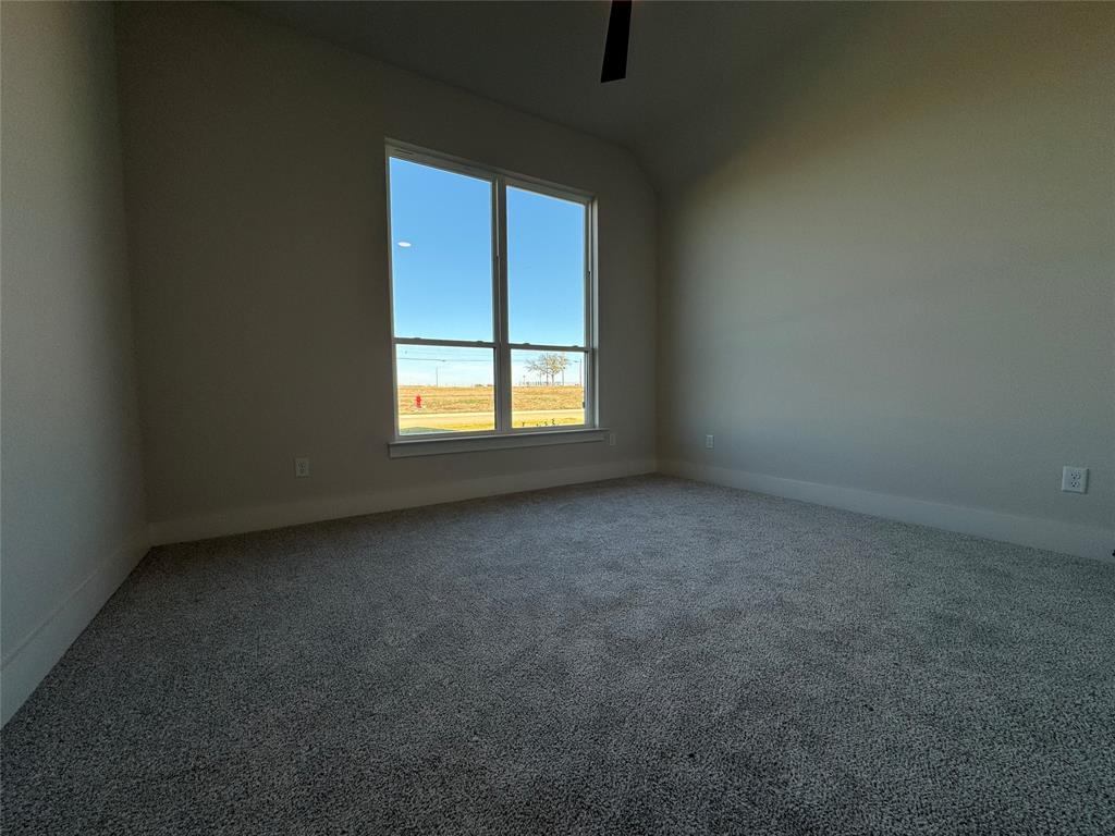 137 Red Fox Trail Godley, TX 76044 - Photo 9 of 18 an empty room with a window