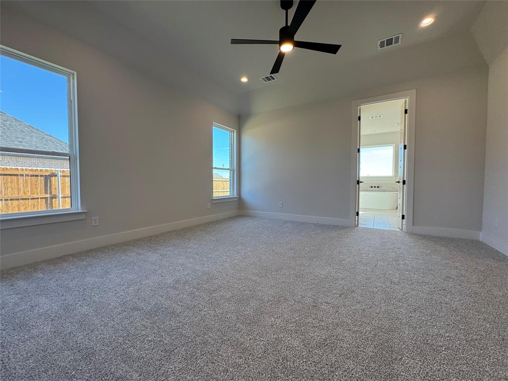 137 Red Fox Trail Godley, TX 76044 - Photo 10 of 18 a view of empty room with windows