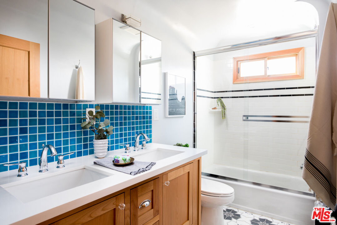 3009 Virginia Road Los Angeles, CA 90016 - Photo 11 of 17 a bathroom with a sink a toilet and shower