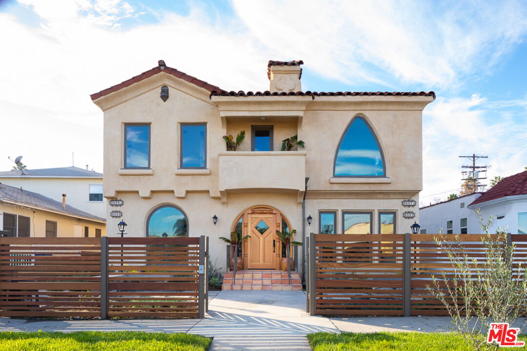 3009 Virginia Road Los Angeles, CA 90016 - Photo 16 of 17 a front view of a house with garden