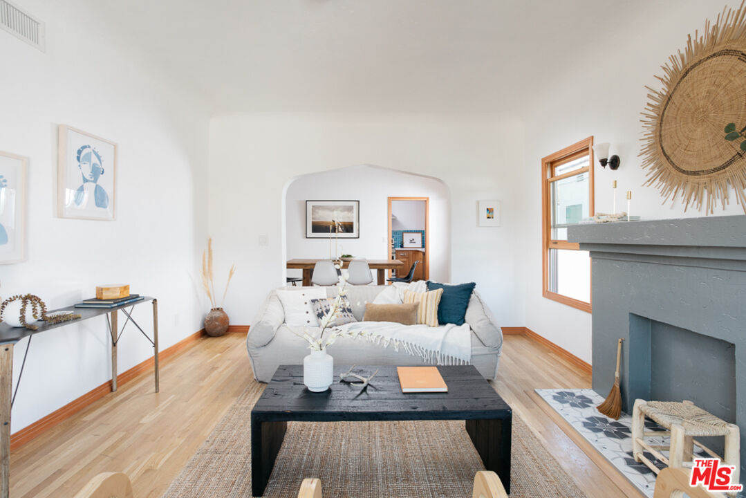 3009 Virginia Road Los Angeles, CA 90016 - Photo 2 of 17 a living room with furniture and a fireplace