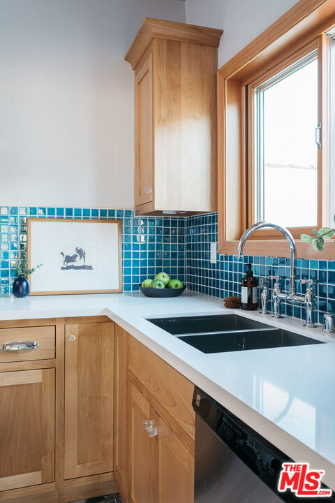 3009 Virginia Road Los Angeles, CA 90016 - Photo 6 of 17 a view of a kitchen with kitchen island a sink and a large window