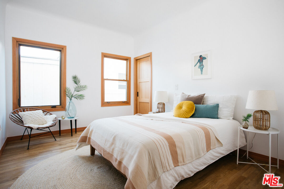 3009 Virginia Road Los Angeles, CA 90016 - Photo 9 of 17 a bedroom with a bed a chair and next to a window