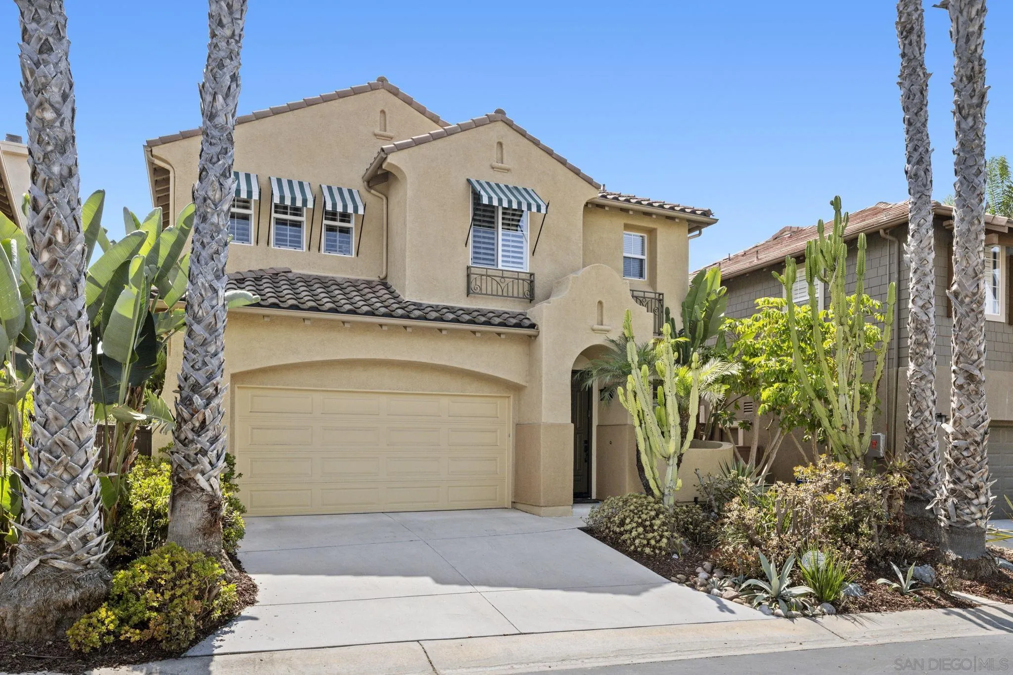 1369 Ranch Road Encinitas, CA 92024 - Photo 1 of 34 a front view of a house with garden