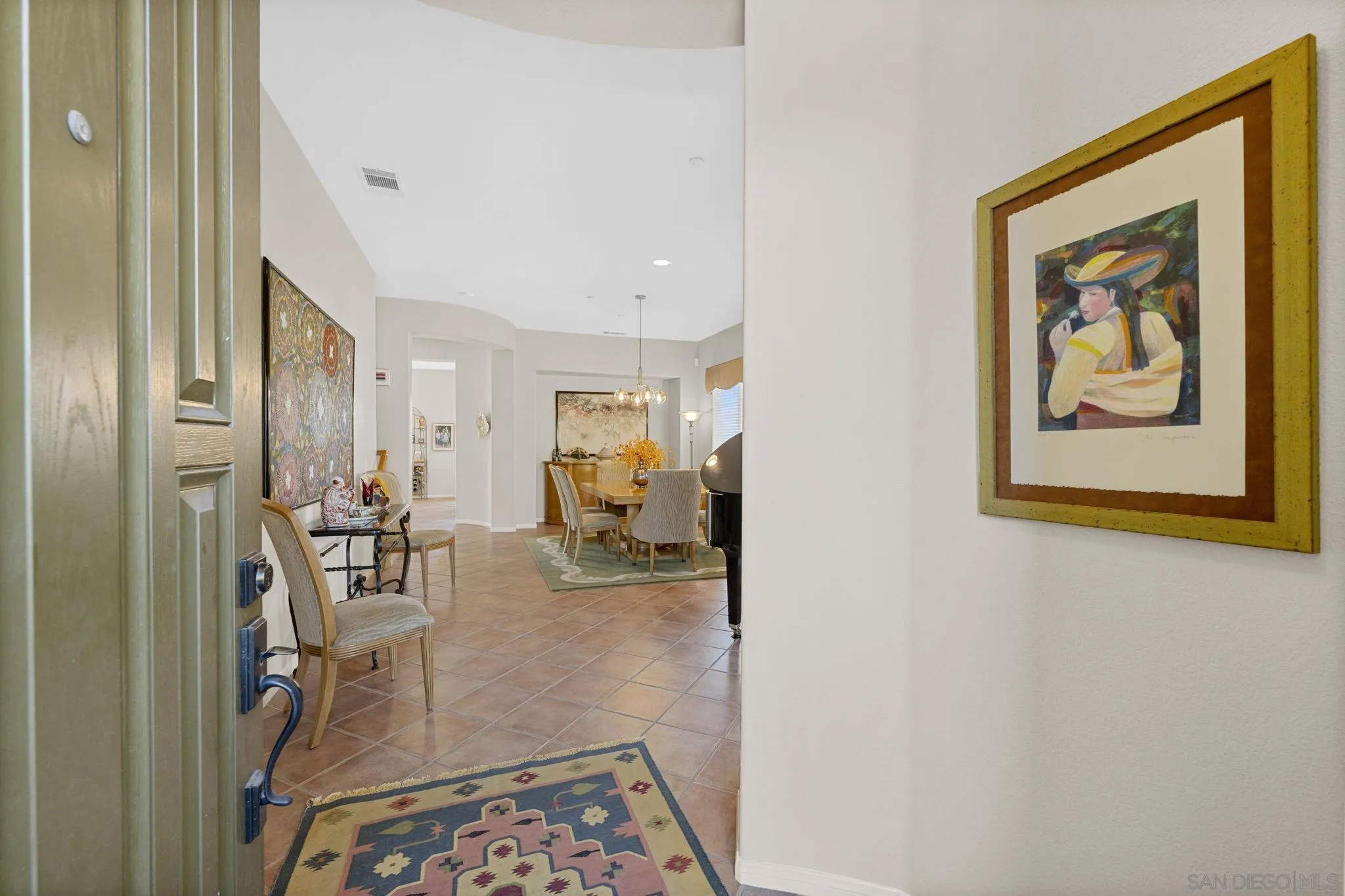 1369 Ranch Road Encinitas, CA 92024 - Photo 16 of 34 a view of a hallway with couch and dining area