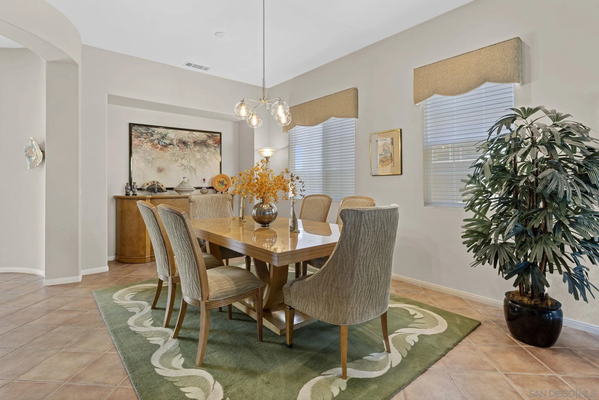 1369 Ranch Road Encinitas, CA 92024 - Photo 17 of 34 a dining room with furniture and window