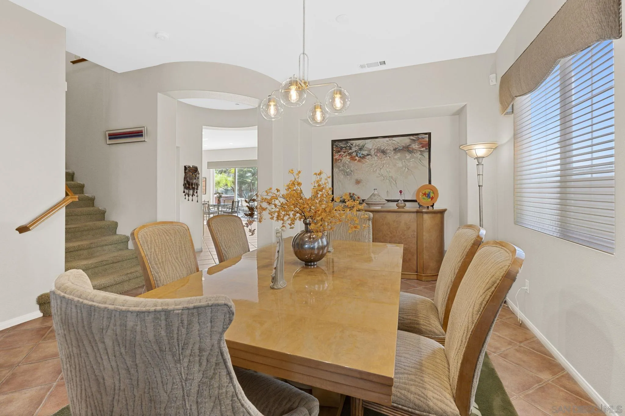 1369 Ranch Road Encinitas, CA 92024 - Photo 19 of 34 a dining room with furniture and window
